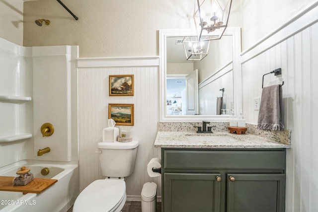 full bathroom with bathtub / shower combination, toilet, vanity, and a chandelier