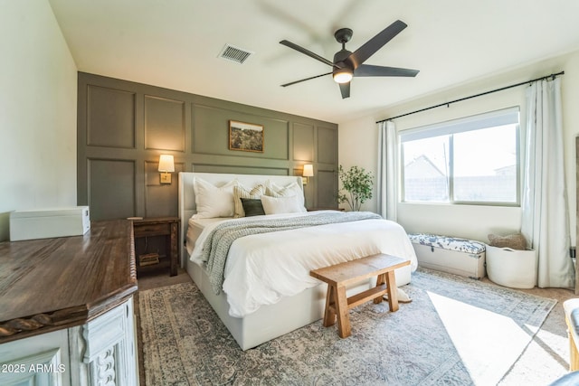 bedroom featuring ceiling fan and dark colored carpet