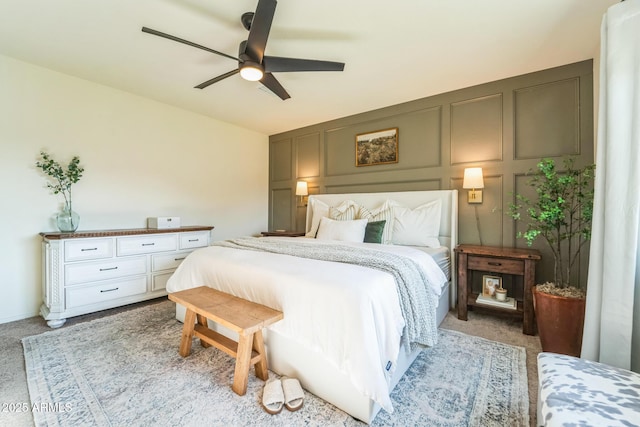 bedroom featuring ceiling fan and light colored carpet