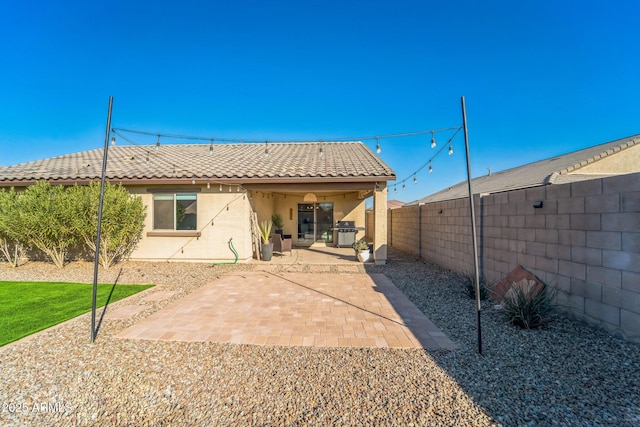 back of property with a patio area