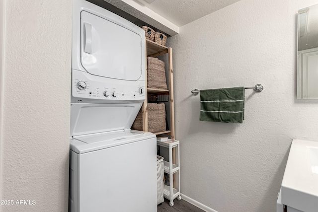 461 W Holmes Ave Unit 350, Mesa, AZ 85210 - laundry room with stacked washer and clothes dryer and a textured wall