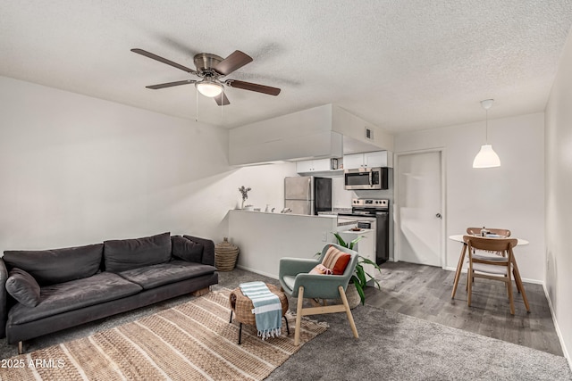 461 W Holmes Ave Unit 350, Mesa, AZ 85210 - living area with wood finished floors, a ceiling fan, and a textured ceiling