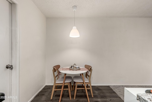 461 W Holmes Ave Unit 350, Mesa, AZ 85210 - dining area featuring dark wood finished floors and a textured ceiling