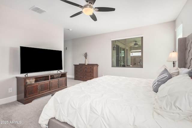 bedroom with visible vents, a ceiling fan, baseboards, and light carpet