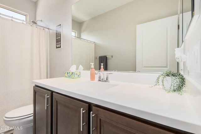 full bath featuring toilet and vanity