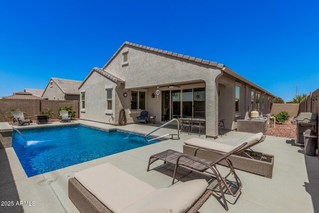 view of swimming pool featuring a ceiling fan, a fenced in pool, a fenced backyard, grilling area, and a patio