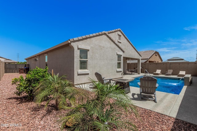 view of swimming pool featuring a fenced backyard, a patio area, and a fenced in pool