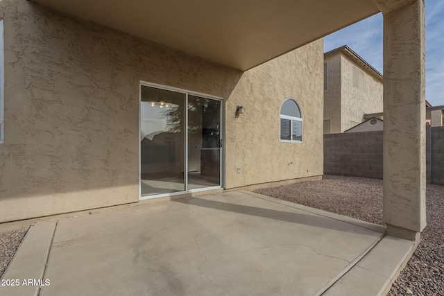 view of patio / terrace featuring fence