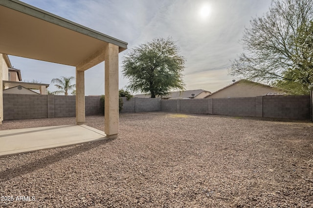 view of yard with a patio area and a fenced backyard