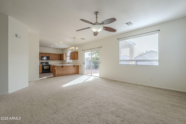 unfurnished living room featuring visible vents, ceiling fan, light carpet, and baseboards