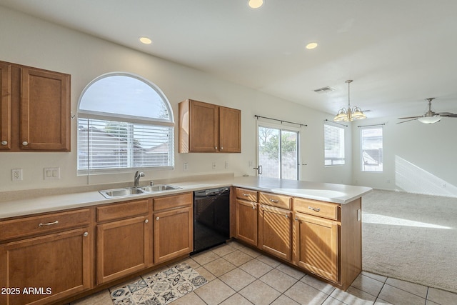 kitchen featuring light carpet, a peninsula, a sink, visible vents, and dishwasher