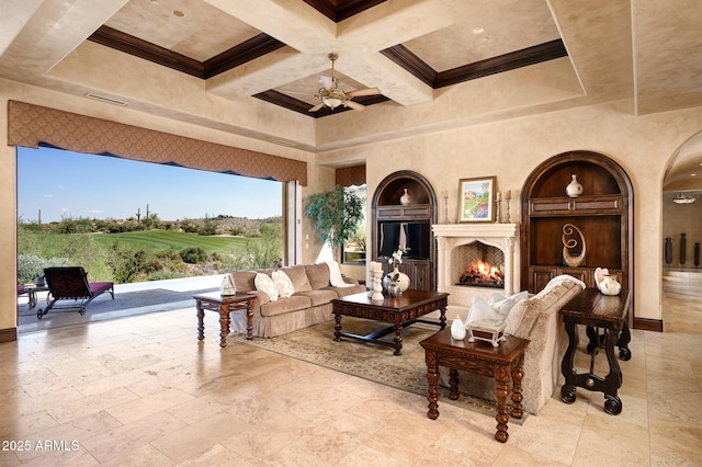 interior space with a ceiling fan and an outdoor living space with a fireplace