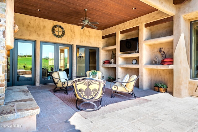 view of patio / terrace with french doors and a ceiling fan