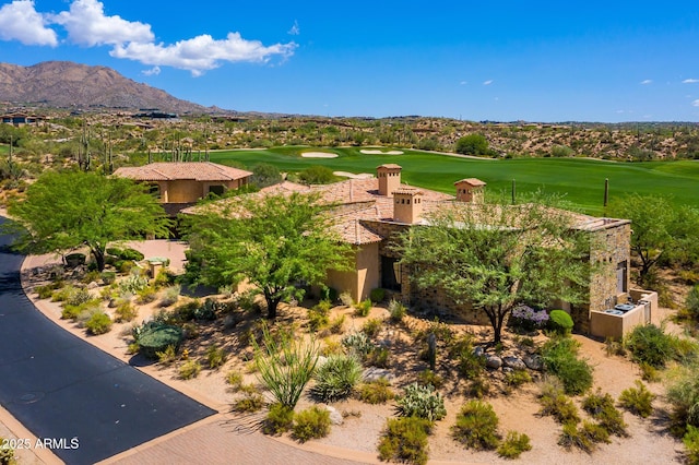 exterior space featuring a mountain view and golf course view