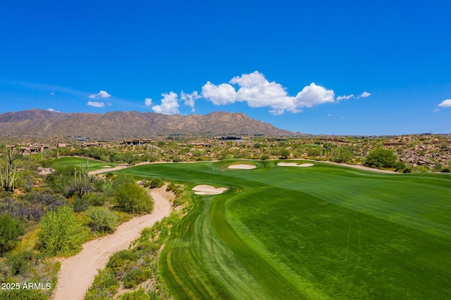 view of community with a mountain view and golf course view