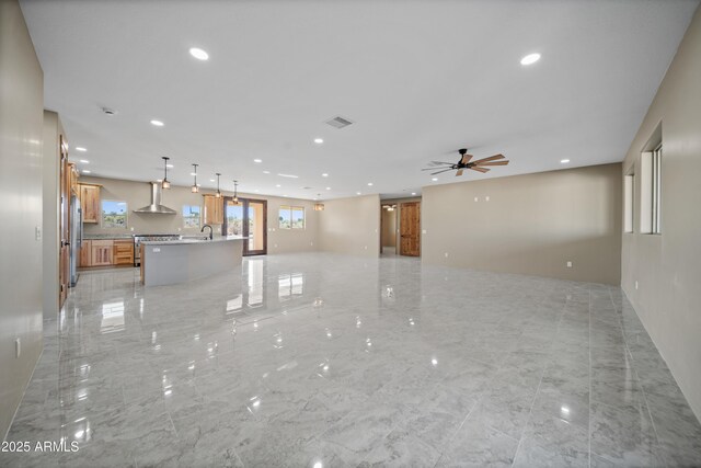 115 Ironwood Pl, Wickenburg, AZ 85390 - unfurnished living room featuring a sink, visible vents, recessed lighting, a ceiling fan, and marble finish floor