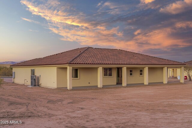 115 Ironwood Pl, Wickenburg, AZ 85390 - back of property at dusk with a tile roof and stucco siding