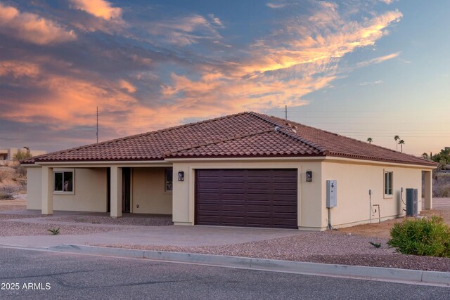 115 Ironwood Pl, Wickenburg, AZ 85390 - mediterranean / spanish-style house with stucco siding, an attached garage, driveway, and a tiled roof