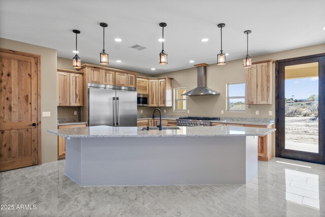 115 Ironwood Pl, Wickenburg, AZ 85390 - kitchen featuring wall chimney range hood, a sink, appliances with stainless steel finishes, visible vents, and recessed lighting