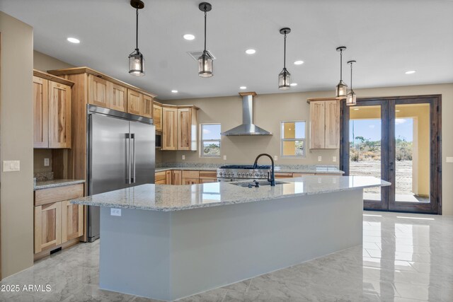 115 Ironwood Pl, Wickenburg, AZ 85390 - kitchen featuring wall chimney range hood, marble finish floor, a sink, and high end appliances