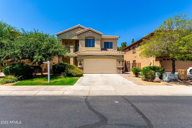 5234 E Carol Ave, Mesa, AZ 85206 - mediterranean / spanish-style house featuring stucco siding, driveway, a garage, and a tiled roof