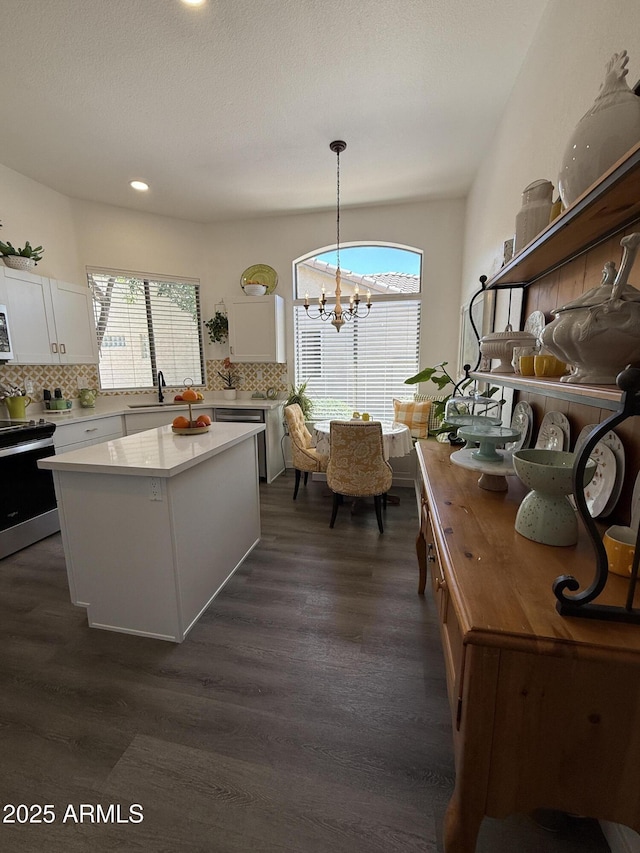 23705 S Pleasant Way, Sun Lakes, AZ 85248 - kitchen featuring white cabinets, tasteful backsplash, a sink, a wealth of natural light, and stainless steel appliances