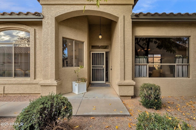 23705 S Pleasant Way, Sun Lakes, AZ 85248 - property entrance with stucco siding and a tile roof