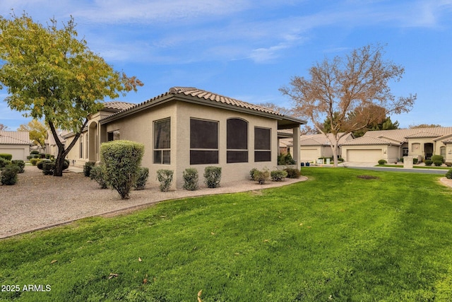 23705 S Pleasant Way, Sun Lakes, AZ 85248 - view of front of property with stucco siding, a tiled roof, and a front yard