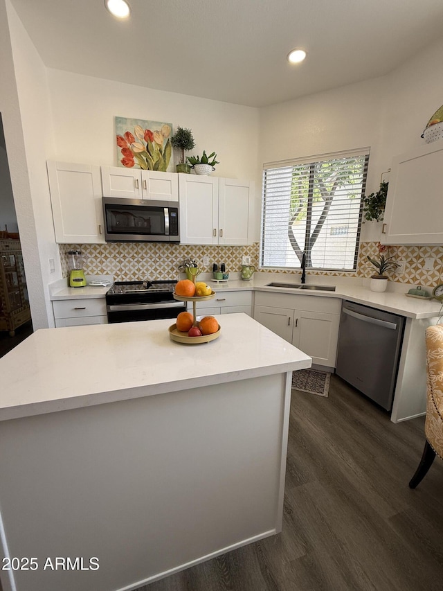 23705 S Pleasant Way, Sun Lakes, AZ 85248 - kitchen with light countertops, a sink, white cabinets, and stainless steel appliances
