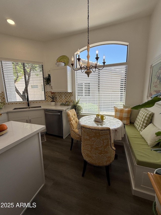 23705 S Pleasant Way, Sun Lakes, AZ 85248 - dining area featuring an inviting chandelier, recessed lighting, dark wood finished floors, and a healthy amount of sunlight