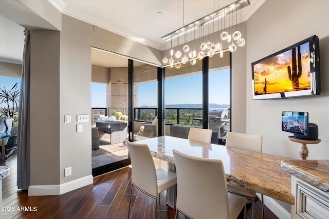 dining room featuring crown molding, dark wood-style floors, and baseboards