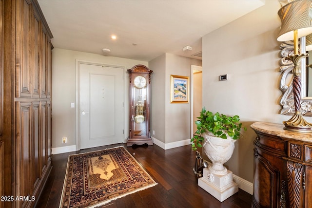 entrance foyer featuring hardwood / wood-style floors and baseboards