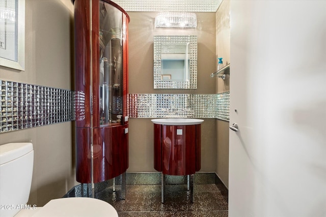 bathroom with toilet and vanity