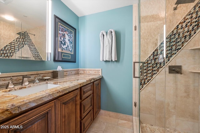 bathroom featuring vanity, a shower stall, and tile patterned flooring