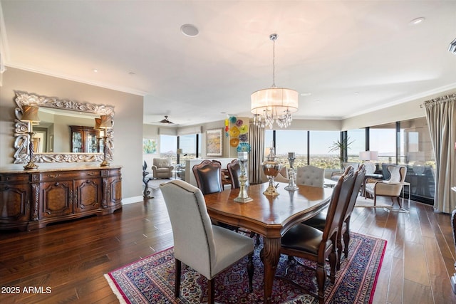 dining room with dark wood finished floors, baseboards, crown molding, and an inviting chandelier