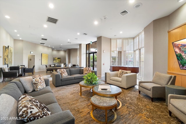 living area with recessed lighting and visible vents