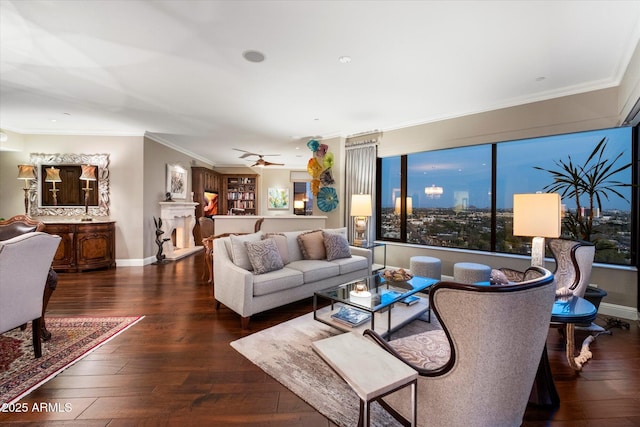 living room with hardwood / wood-style floors, baseboards, and ornamental molding