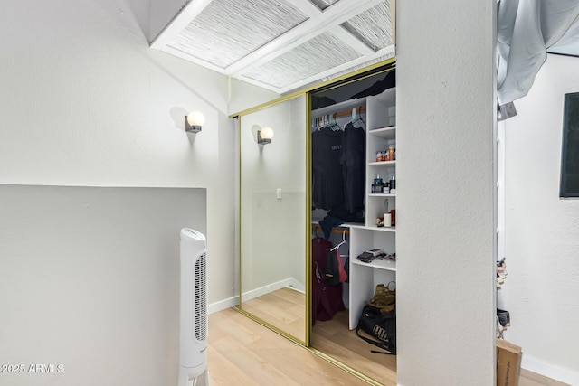 interior space featuring visible vents, baseboards, and wood finished floors