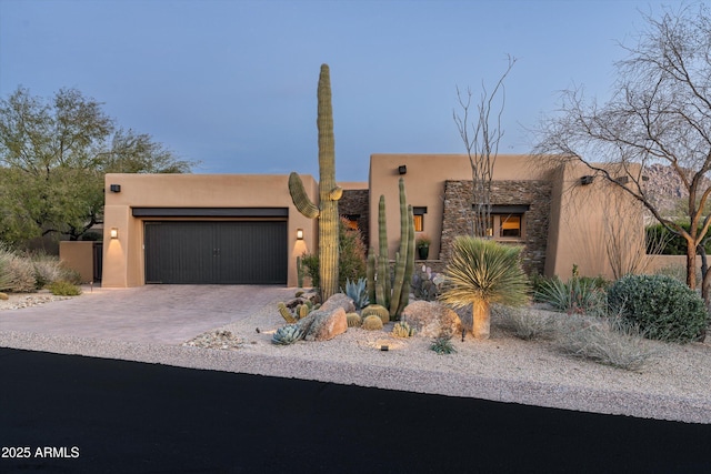 adobe home featuring a garage