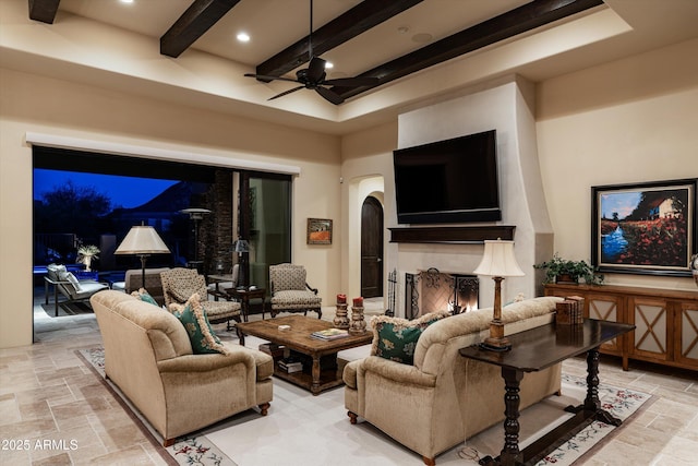 interior space with ceiling fan and a towering ceiling