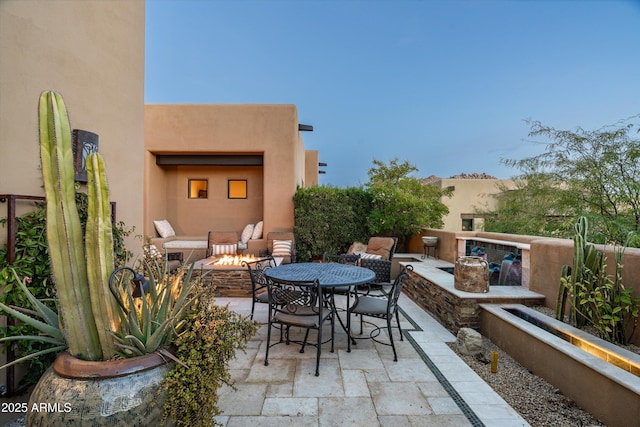 view of patio featuring an outdoor fire pit