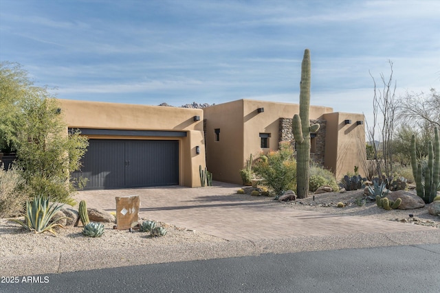 southwest-style home featuring a garage