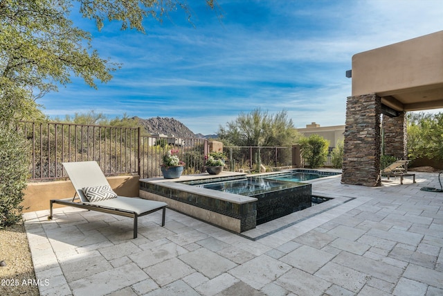 view of pool featuring an in ground hot tub and a patio area