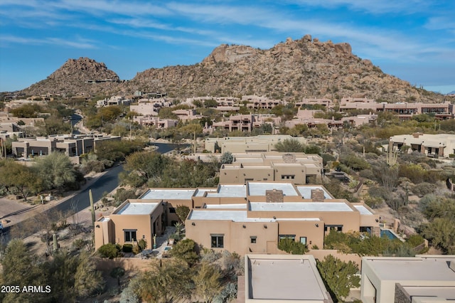 birds eye view of property featuring a mountain view