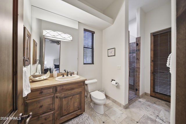 bathroom featuring vanity, toilet, and walk in shower