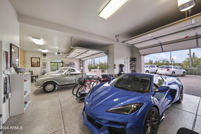 garage with a carport and a garage door opener