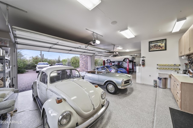 garage with a garage door opener and sink