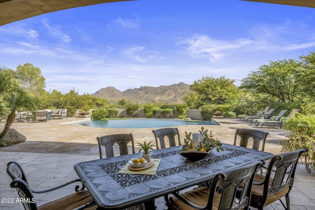 view of patio / terrace with a mountain view