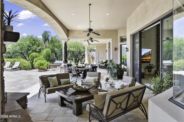 view of patio / terrace with an outdoor living space and ceiling fan