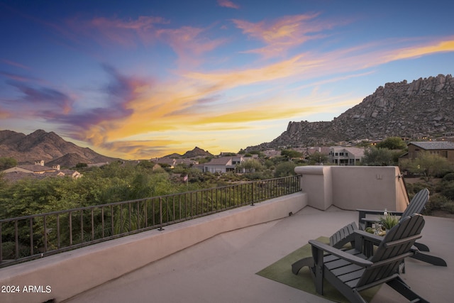 patio terrace at dusk with a mountain view